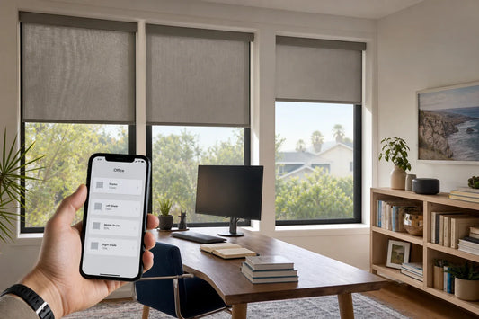 Motorized window shades controlled from a phone in a bright living room