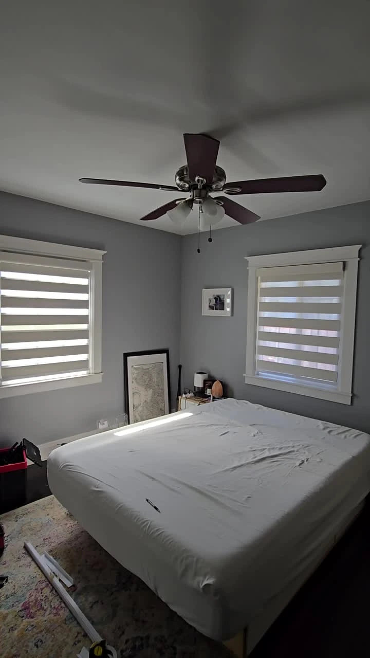 Zebra shades in a bedroom