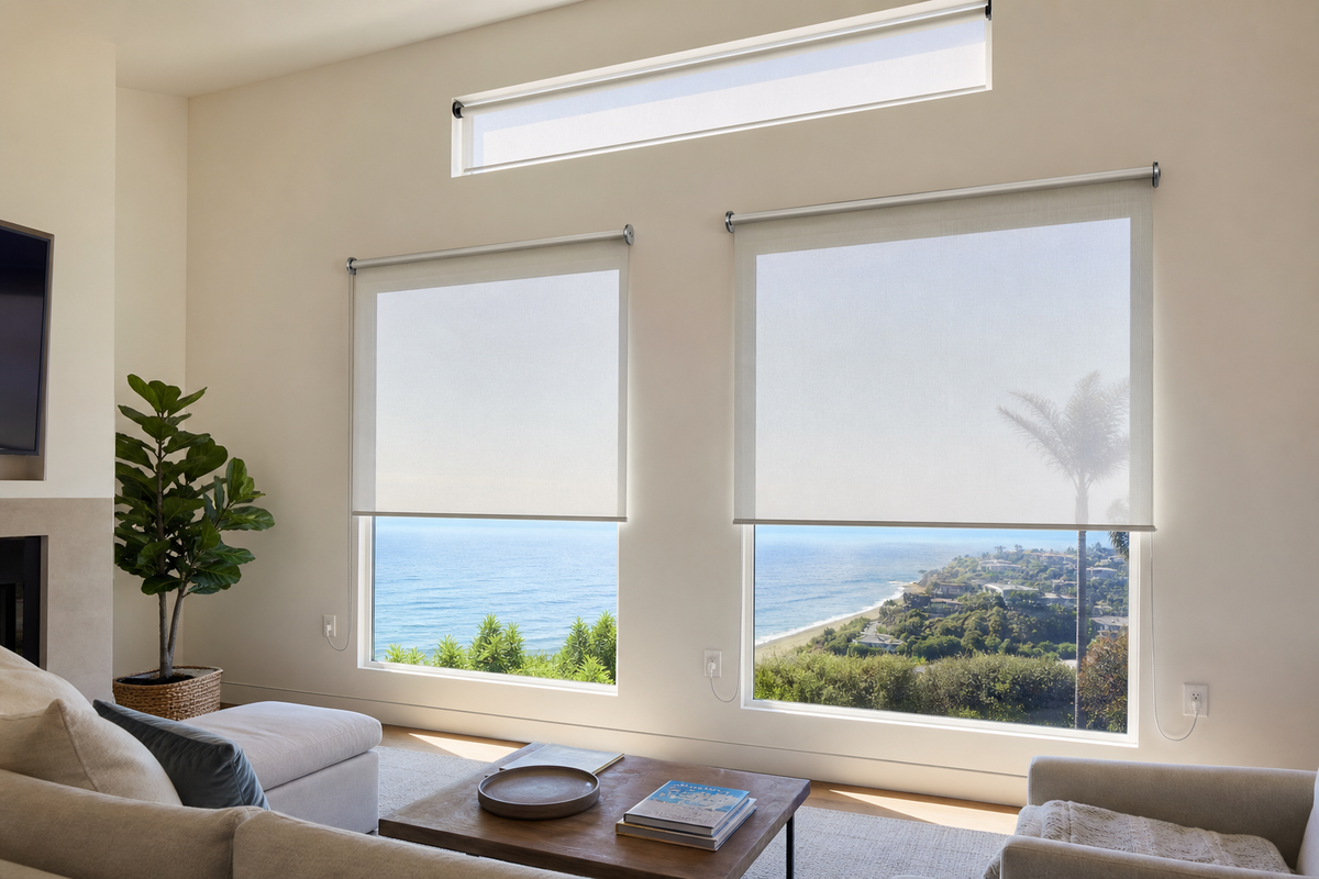 Light-filtering roller shades softening direct sun in a bright South Bay living room