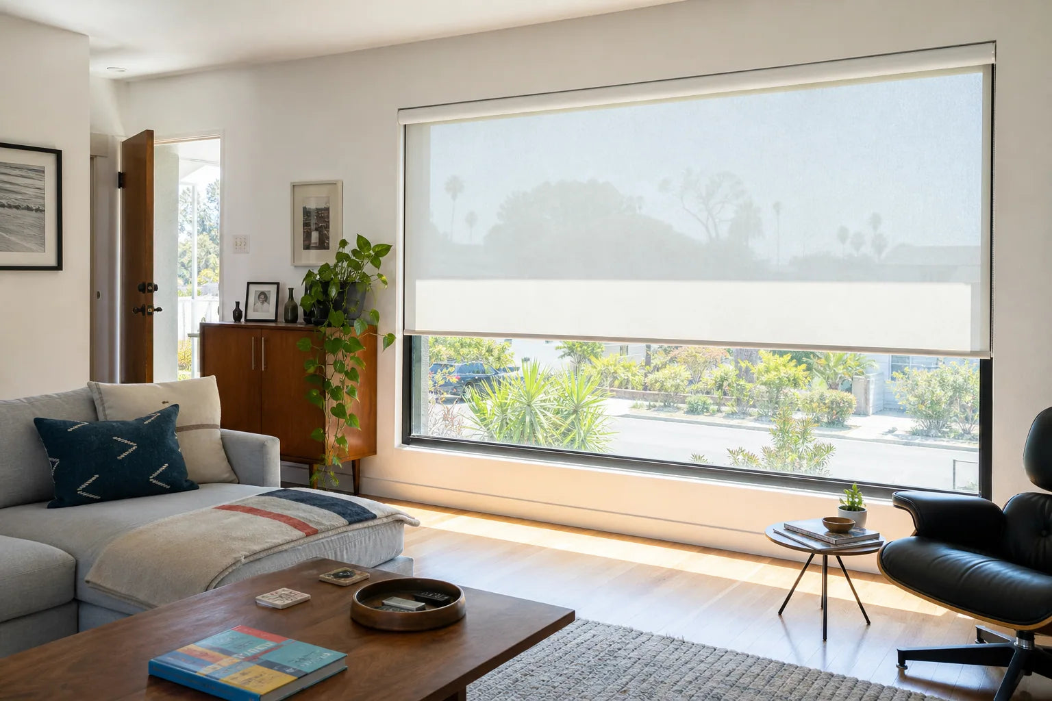 Bright South Bay living room with harsh direct sun across the seating area and television