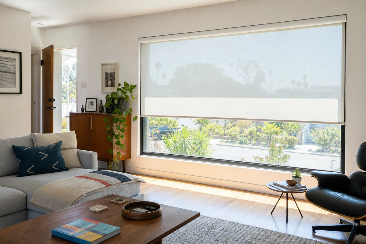 Light-filtering roller shades reducing harsh sunlight in a South Bay living room